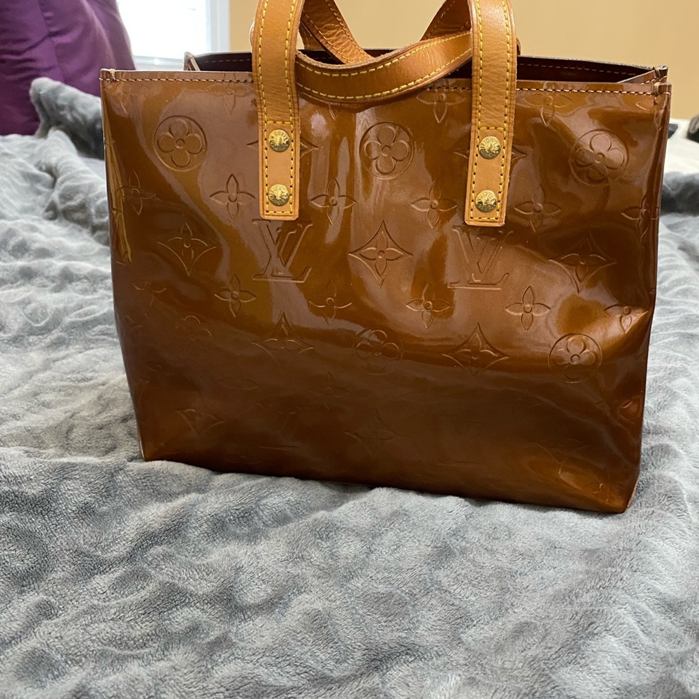 Authentic Vintage Louis Vuitton Veris tote in the color of copper.